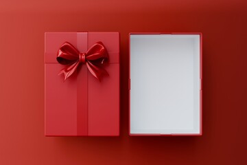 Overhead view of a separate red gift box lid with a fancy bow and the main empty box with a white interior, all on a red surface.