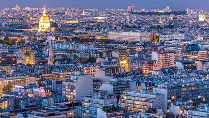 Aerial panorama above houses rooftops in a Paris day to night timelapse
