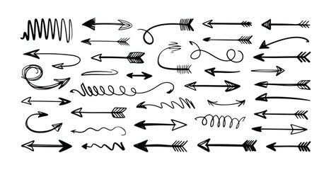 Fototapeta premium Set of diverse hand drawn arrows illustrating various directions movement and design elements for projects