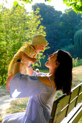 Mother and Baby Enjoying a Sunny Day in the Park Portrait
