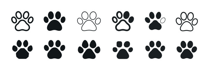 Fototapeta premium Variety of dog paw print designs in black and white illustrations