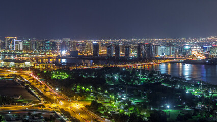 Obraz premium View of lights from illuminated roads and windows in luxury Dubai city, United Arab Emirates Timelapse Aerial