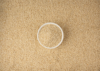 Sesame seeds pile closeup, white small benne grains. Sesamum indicum fruits