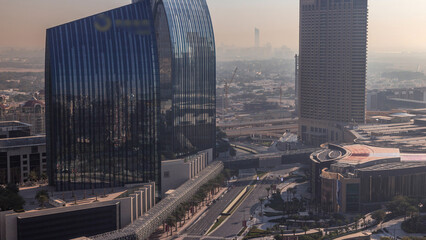 Dubai downtown street with busy traffic and skyscrapers around morning timelapse.