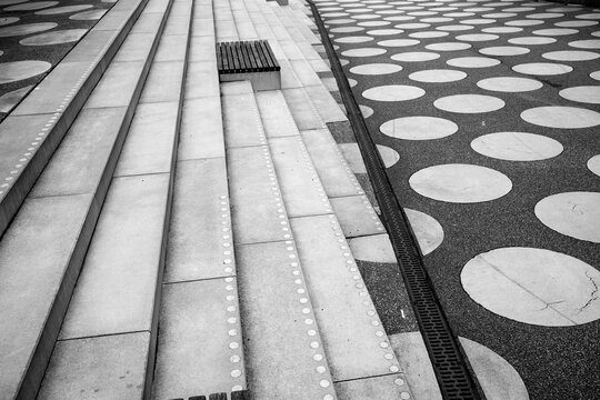 Monochrome urban staircase captured as a geometric modern pathway, using outdoors minimalism, structure, design and perspective to highlight patterned architectural forms