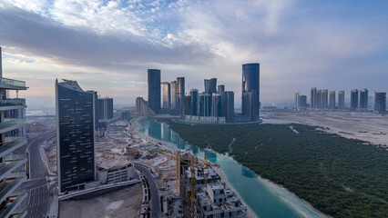 Buildings on Al Reem island in Abu Dhabi timelapse from above.