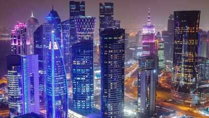 Obraz premium The skyline of the West Bay area from top in Doha day to night timelapse, Qatar.