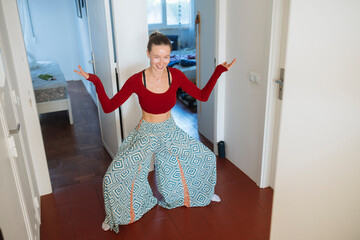 Expressive woman exhibits playful confidence during indoor activity session