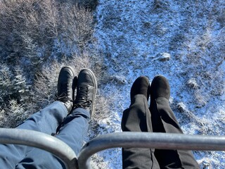 feet of a man and a woman in winter