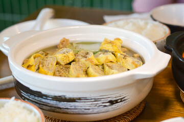 Close-up Yunnan hotpots in a white bowl. Delicious Chinese food.