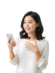 Smiling Asian woman holds smartphone expressing delight and heartfelt appreciation while engaging with modern mobile technology connection