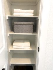 Linen Closet with Towels and Storage Bins