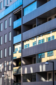 Modern architecture facade presenting geometric pattern shapes with abstract building symmetry, reflection and minimalism in a sharp linear composition