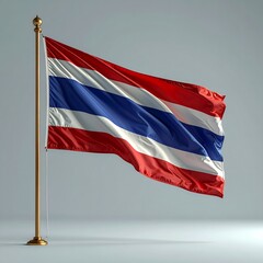 Vibrant Thai Flag Waving Proudly on a Gold Pole Against a Soft Grey Background.