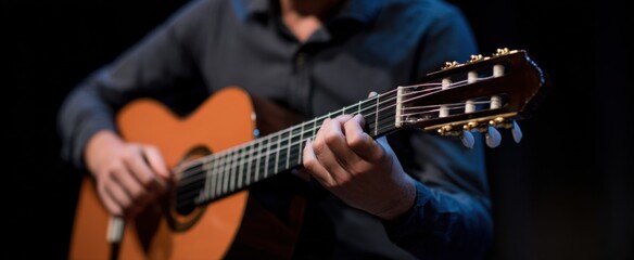 musician tuning guitar strings in preparation for performance
