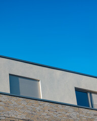 Modern architecture with clear blue sky over a minimalist building in a sunny environment