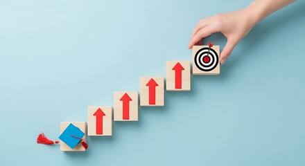 Hand placing final block with target symbolizing educational achievement and career progression success