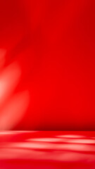 Dark red wall and empty table background. Composition with abstract shadow on the wall and pink table. Mock up for presentation, branding products, cosmetics, food or jewelry.