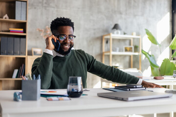 Man making phone call enjoying remote work