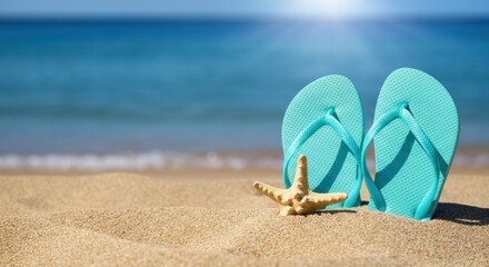 Blue flip flops with starfish on sandy beach and sunlit calm sea horizon