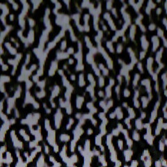 Una toma de cerca de un fondo abstracto del pixelado de la pantalla de una televisor en un fondo oscuro