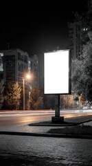 Blank billboard illuminated at night with empty copy space advertisement