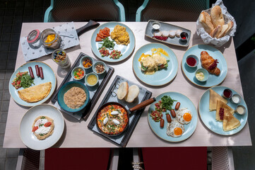 the table is served and covered with a large number of different dishes