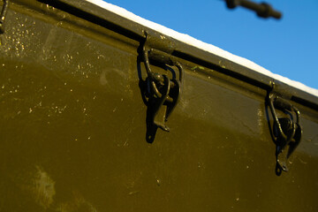 Detail of Latch Mechanism on an Olive-Green Military Vehicle Exterior