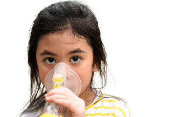 Cute asian girl with asthma using inhaler and spacer,Respiratory system and allergies	