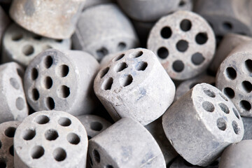 Carbon dioxide reforming of methane nickel catalyst seven holes cylinder pellet form shape methanol synthesis industrial petrochemical selective focus close up vertical shot texture background.