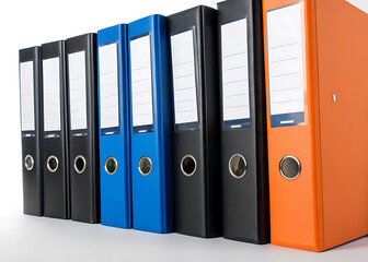 Colorful ring binder file folders arranged in a row on a white surface for organization and storage