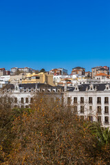 Naklejka premium Sunny cityscape of Santander in Northern Spain with autumn park