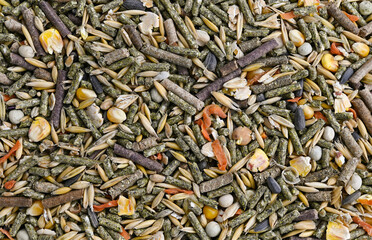 Background of balanced food for rodents, for guinea pigs. Top view. Full depth of field.