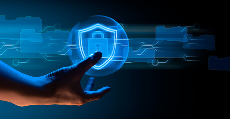 hand of businessman interactive touching a holographic anti-virus security shield system network and technology, success of innovation