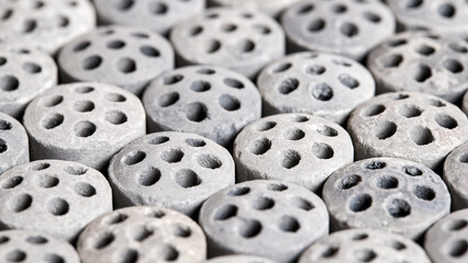 Carbon dioxide reforming of methane nickel catalyst seven holes cylinder pellet form shape methanol synthesis industrial petrochemical selective focus close up vertical shot texture background.