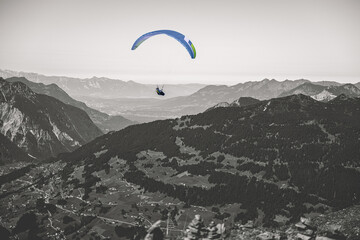 paragliding adventure in mountain landscape © Eddiesphoto