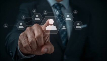 A person selects a human icon on digital display, representing connection and network