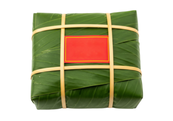 Vietnamese Banh Chung Traditional Square Sticky Rice Cake Wrapped in Banana Leaves Tied with Bamboo and Red Label