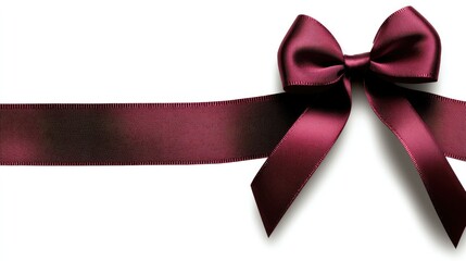 A vibrant red bow with a silky ribbon lies against a clean white backdrop, perfect for adding charm to gifts and decorations