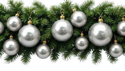 Row of shimmering silver christmas baubles hanging from lush green fir tree branches creating a festive holiday border design