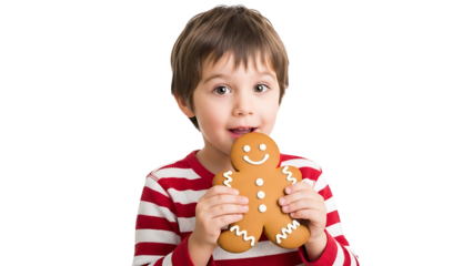 A joyful young boy holding a gingerbread man with a look of excitement