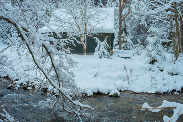 Cozy Snowy Winter Village with Traditional Houses and Peaceful Rural Landscape