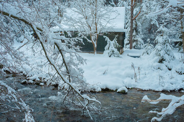 Cozy Snowy Winter Village with Traditional Houses and Peaceful Rural Landscape