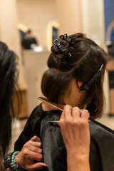 Fototapeta premium Hair Cutting Technique with Sectioned Hair in Salon