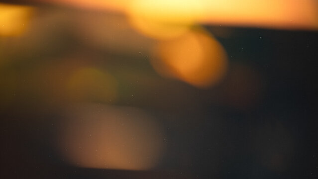 light leak overlay effect with scratch dust and yellow light leaks,retro grain noisy film flare on black background,analog old film burn overlay,abstract background with motion blur ray