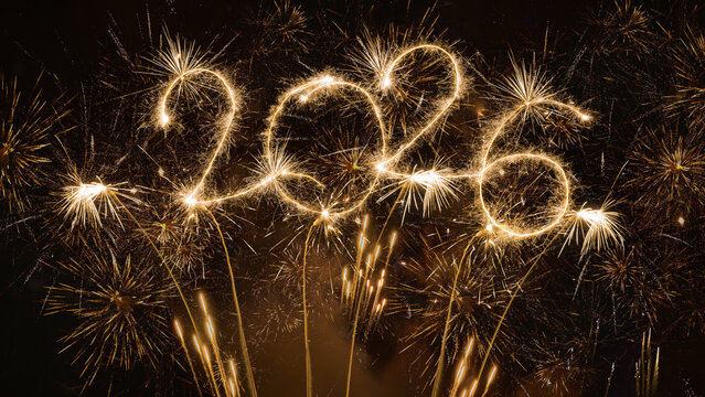 happy new year, new year's eve, silvester, new year, celebration greeting card, new year card - Year 2026 in sparkler font and firework fireworks pyrotechnic, isolated on black night sky background