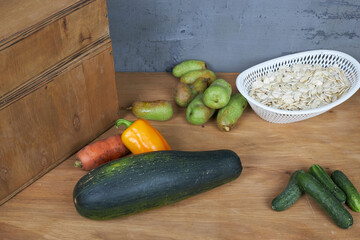 Autumn harvest, vegetables and fruits lie on a wooden table.
