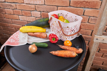 Autumn harvest, vegetables are lying near the basket.