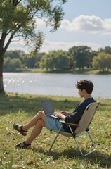 man sitting on a bench with a laptop