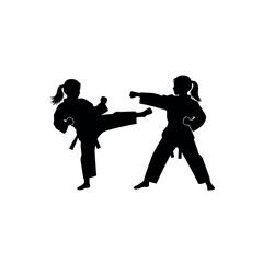 Two girls practicing karate silhouette.